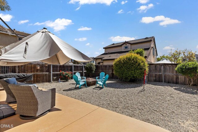 2024 Green Ridge Cir, Lompoc, CA 93436 - fenced backyard featuring an outdoor fire pit and a patio