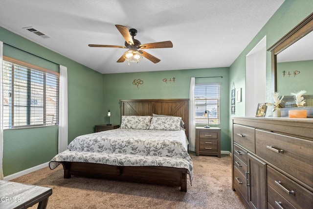 2024 Green Ridge Cir, Lompoc, CA 93436 - bedroom with multiple windows, light colored carpet, and a ceiling fan