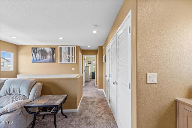2024 Green Ridge Cir, Lompoc, CA 93436 - hall featuring light carpet, a textured wall, and recessed lighting