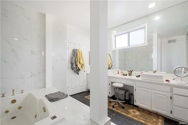 22329 Plummer St, Chatsworth, CA 91311 - bathroom featuring marble tiled floors, a whirlpool tub, and vanity
