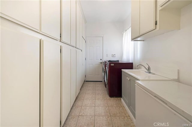 22329 Plummer St, Chatsworth, CA 91311 - laundry area with washer and clothes dryer, cabinet space, and light tile patterned floors