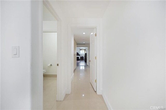 22329 Plummer St, Chatsworth, CA 91311 - hall featuring light tile patterned floors and baseboards