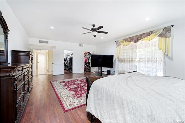 22329 Plummer St, Chatsworth, CA 91311 - bedroom with dark wood finished floors, a walk in closet, a ceiling fan, and recessed lighting