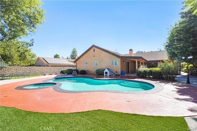 22329 Plummer St, Chatsworth, CA 91311 - view of swimming pool featuring fence, a patio, and a pool with connected hot tub