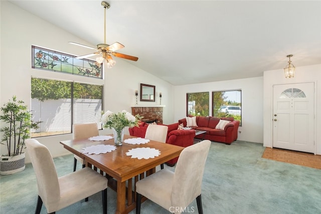30872 Kiowa River Ct, Temecula, CA 92591 - dining area featuring light colored carpet, ceiling fan, a fireplace, and high vaulted ceiling