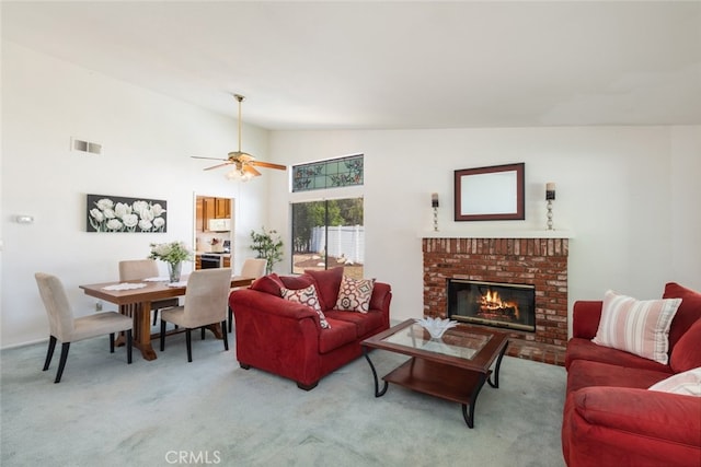 30872 Kiowa River Ct, Temecula, CA 92591 - living room featuring light carpet, vaulted ceiling, a brick fireplace, and ceiling fan