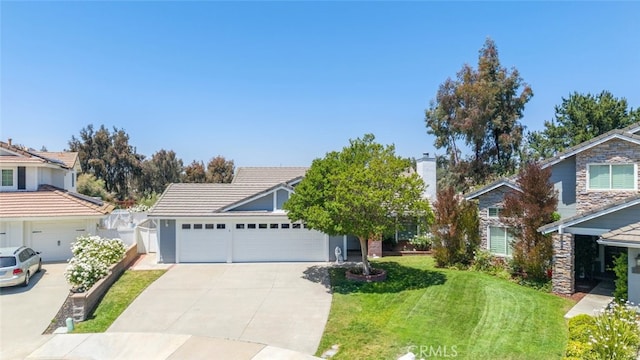 30872 Kiowa River Ct, Temecula, CA 92591 - view of front of home with a front yard, driveway, stone siding, and a tiled roof