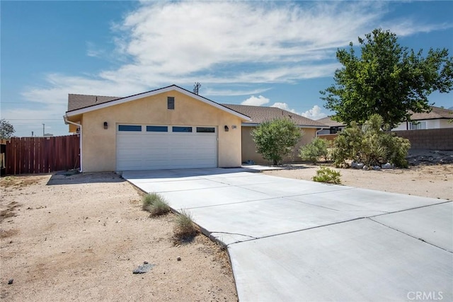 6649 Pine Spring Ave Unit 29, Palms, CA 92277 - ranch-style home with stucco siding, concrete driveway, and an attached garage