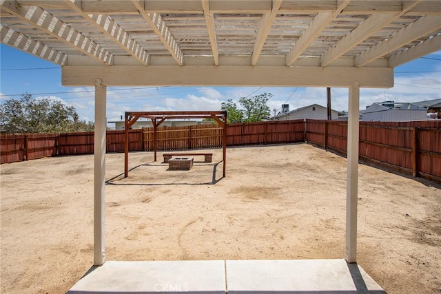 6649 Pine Spring Ave Unit 29, Palms, CA 92277 - fenced backyard featuring a fire pit
