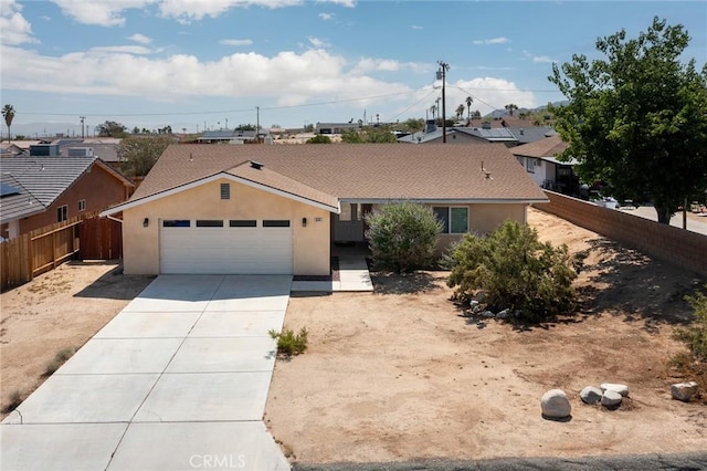 6649 Pine Spring Ave Unit 29, Palms, CA 92277 - single story home featuring driveway, a garage, and stucco siding