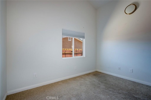 6649 Pine Spring Ave Unit 29, Palms, CA 92277 - empty room featuring carpet floors, baseboards, and lofted ceiling