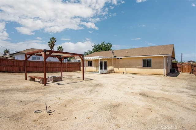 6649 Pine Spring Ave Unit 29, Palms, CA 92277 - back of property featuring french doors, a fenced backyard, a patio area, central air condition unit, and stucco siding