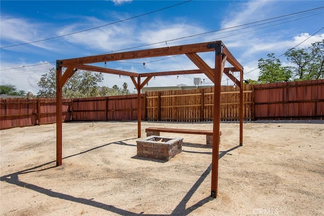 6649 Pine Spring Ave Unit 29, Palms, CA 92277 - fenced backyard featuring a fire pit