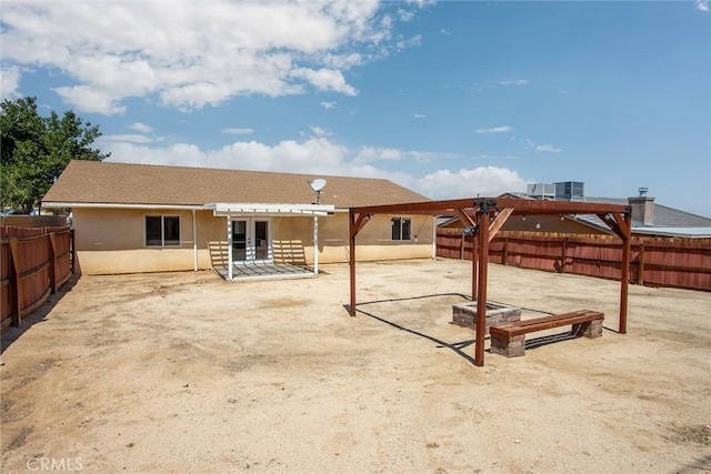 6649 Pine Spring Ave Unit 29, Palms, CA 92277 - rear view of house with a patio, a pergola, a fenced backyard, and stucco siding