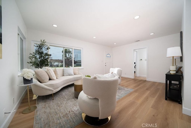 13282-13280 Nevada St, Westminster, CA 92683 - living area with light wood-style floors, recessed lighting, and baseboards