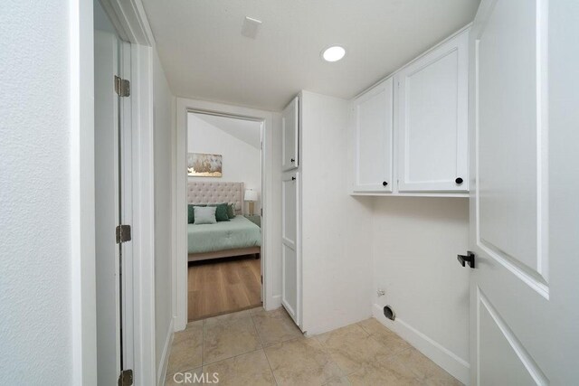13282-13280 Nevada St, Westminster, CA 92683 - laundry area with cabinet space, light tile patterned floors, baseboards, recessed lighting, and electric dryer hookup