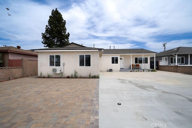 13282-13280 Nevada St, Westminster, CA 92683 - view of front of property featuring fence, stucco siding, and a patio