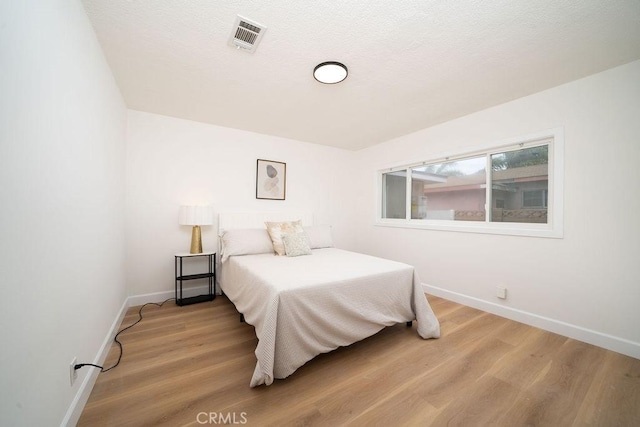 13282-13280 Nevada St, Westminster, CA 92683 - bedroom with baseboards and light wood-type flooring