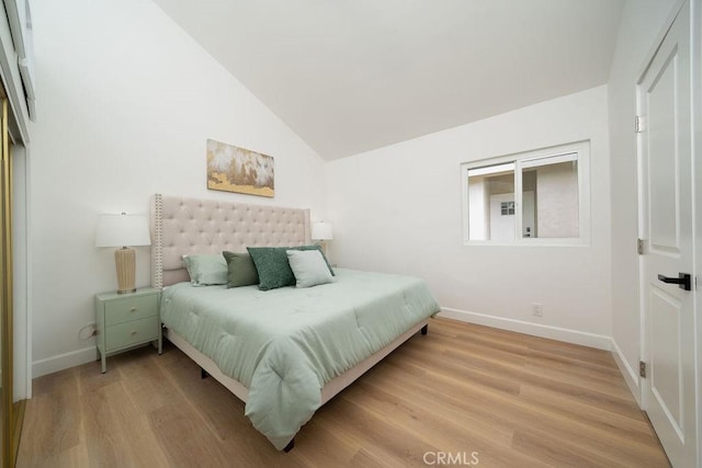 13282-13280 Nevada St, Westminster, CA 92683 - bedroom with lofted ceiling, baseboards, and light wood-type flooring