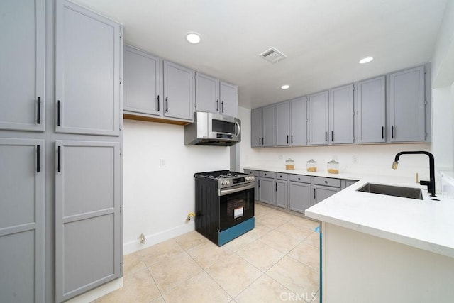 13282-13280 Nevada St, Westminster, CA 92683 - kitchen with a sink, gray cabinets, stainless steel appliances, light countertops, and light tile patterned flooring