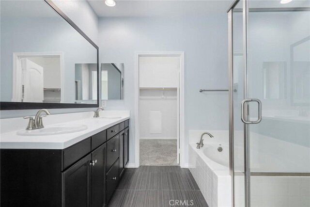 26703 Lexington Ln, Saugus, CA 91350 - full bathroom featuring a shower stall, a spacious closet, a garden tub, double vanity, and tile patterned flooring