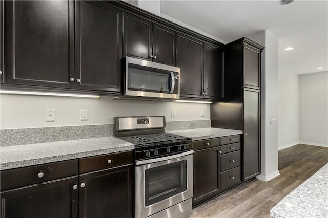 26703 Lexington Ln, Saugus, CA 91350 - kitchen with appliances with stainless steel finishes, light wood-type flooring, light countertops, recessed lighting, and baseboards