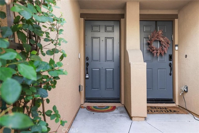 26703 Lexington Ln, Saugus, CA 91350 - view of exterior entry featuring stucco siding