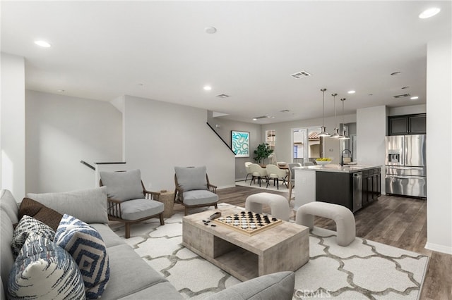 26703 Lexington Ln, Saugus, CA 91350 - living area with wood finished floors, recessed lighting, and baseboards