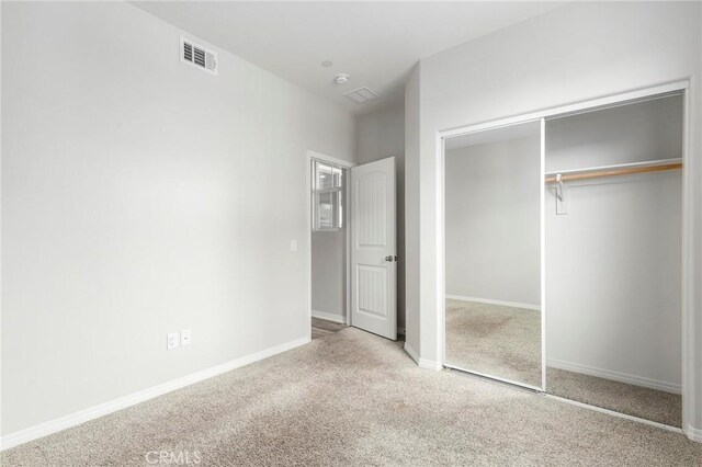 26703 Lexington Ln, Saugus, CA 91350 - unfurnished bedroom featuring a closet, carpet floors, and baseboards