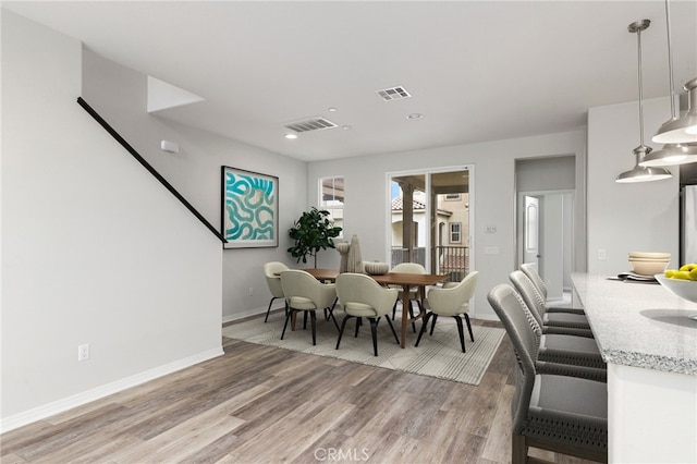 26703 Lexington Ln, Saugus, CA 91350 - dining room with light wood-type flooring, baseboards, and recessed lighting