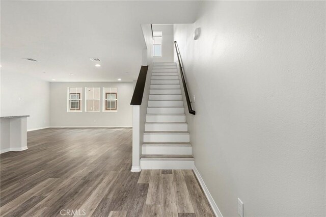 26703 Lexington Ln, Saugus, CA 91350 - staircase with baseboards, wood finished floors, and recessed lighting