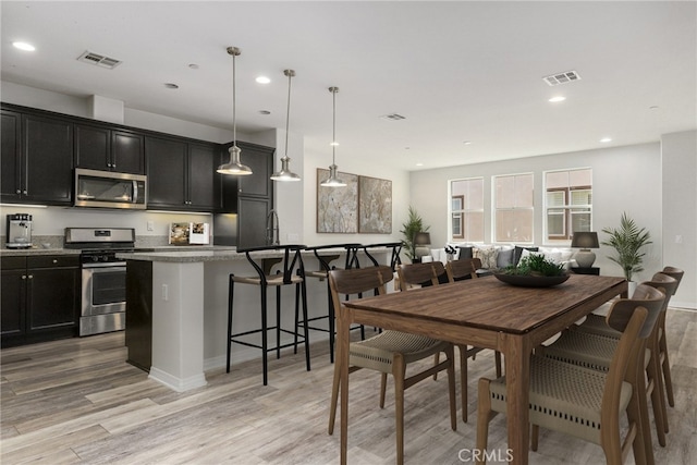 26703 Lexington Ln, Saugus, CA 91350 - dining area with light wood-style flooring, recessed lighting, and baseboards
