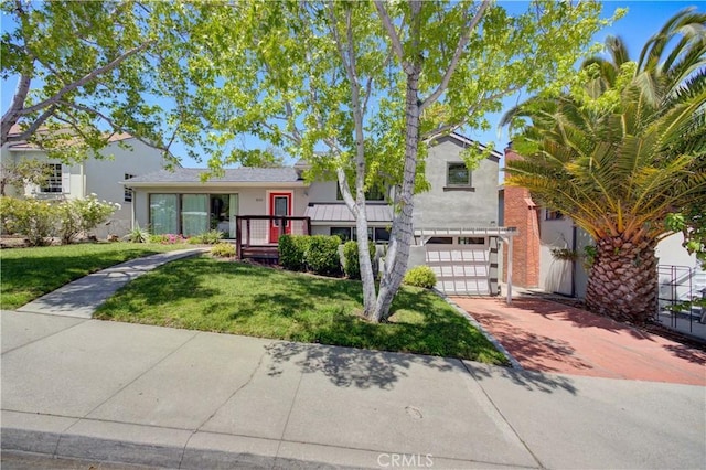810 Meinecke Ave, San Luis Obispo, CA 93405 - view of front of house featuring an attached garage, a front lawn, concrete driveway, and stucco siding