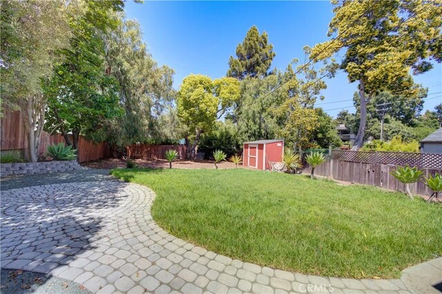 810 Meinecke Ave, San Luis Obispo, CA 93405 - fenced backyard with a storage unit and a patio area