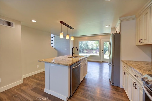 810 Meinecke Ave, San Luis Obispo, CA 93405 - kitchen with stainless steel appliances, dark wood finished floors, a kitchen island with sink, light stone countertops, and recessed lighting