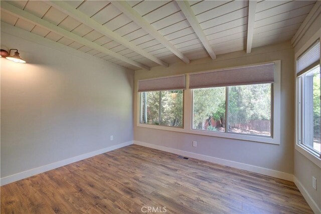 810 Meinecke Ave, San Luis Obispo, CA 93405 - spare room with plenty of natural light, wood finished floors, and a wooden ceiling with exposed beams