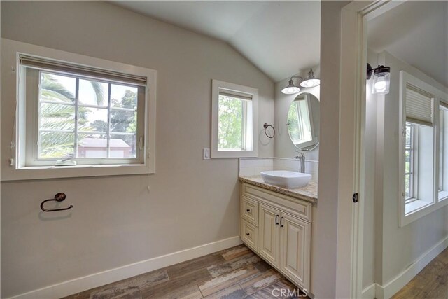 810 Meinecke Ave, San Luis Obispo, CA 93405 - bathroom featuring vanity, vaulted ceiling, and wood finished floors