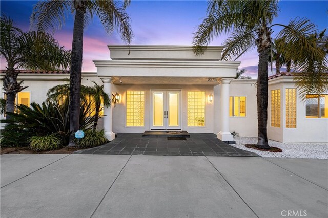 4462 Fallsbrae Rd, Fallbrook, CA 92028 - view of front facade with french doors, stucco siding, and driveway