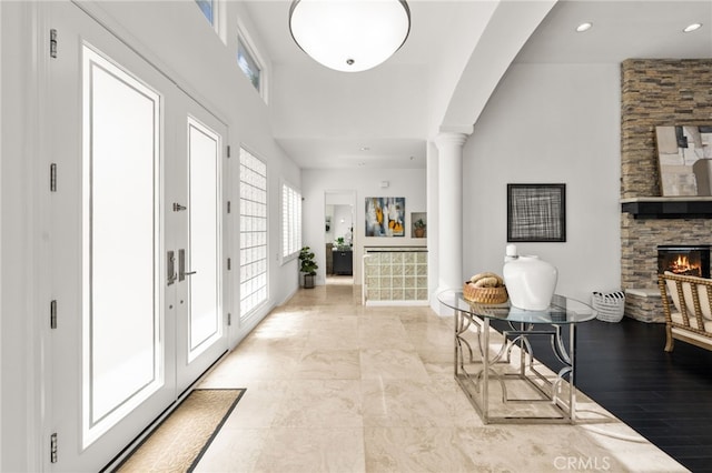 4462 Fallsbrae Rd, Fallbrook, CA 92028 - entrance foyer featuring a stone fireplace, decorative columns, a towering ceiling, recessed lighting, and baseboards