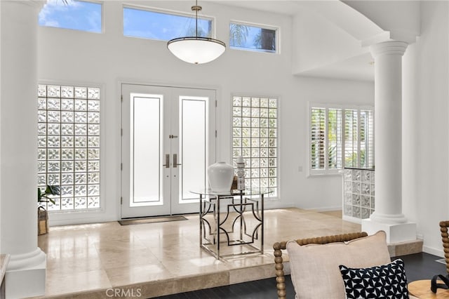 4462 Fallsbrae Rd, Fallbrook, CA 92028 - entrance foyer with ornate columns, a high ceiling, baseboards, and french doors