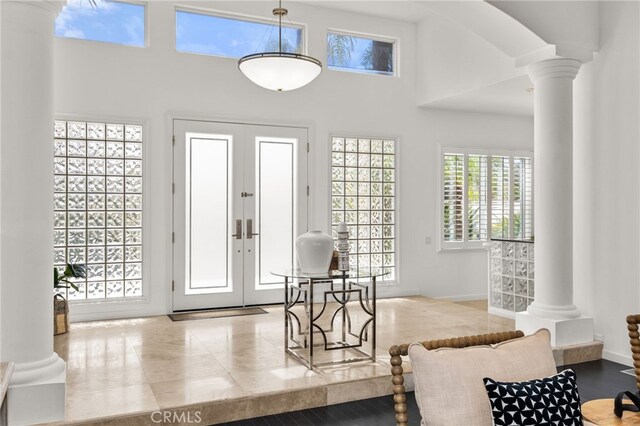 4462 Fallsbrae Rd, Fallbrook, CA 92028 - entrance foyer with ornate columns, a high ceiling, baseboards, and french doors