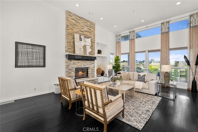 4462 Fallsbrae Rd, Fallbrook, CA 92028 - living room with a towering ceiling, a fireplace, wood finished floors, recessed lighting, and baseboards