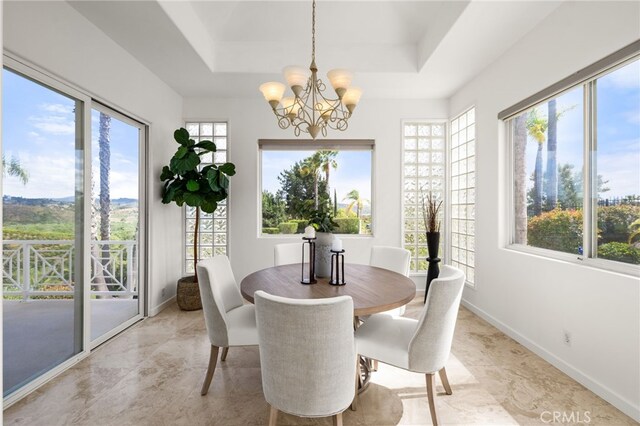 4462 Fallsbrae Rd, Fallbrook, CA 92028 - dining area featuring a tray ceiling, a chandelier, and baseboards