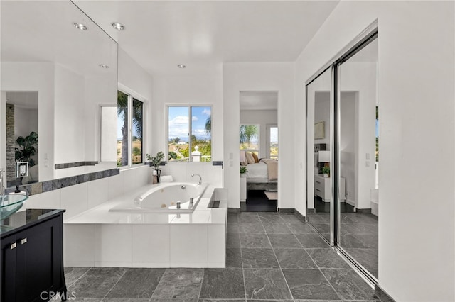 4462 Fallsbrae Rd, Fallbrook, CA 92028 - bathroom featuring ensuite bathroom, a jetted tub, vanity, and recessed lighting