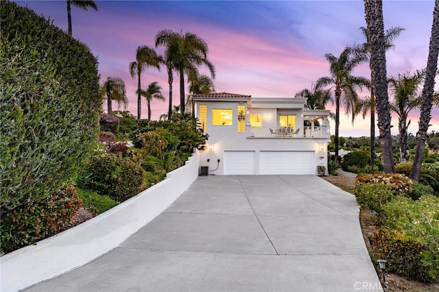 4462 Fallsbrae Rd, Fallbrook, CA 92028 - view of front of home featuring a garage, stucco siding, concrete driveway, and a balcony