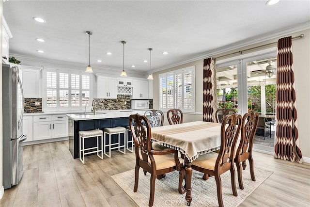 2517 Macbeth Ave, Corona, CA 92882 - dining area with crown molding, light wood-style floors, recessed lighting, and ceiling fan