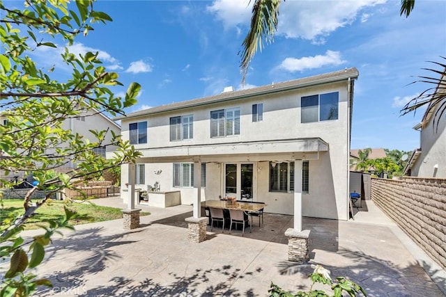 2517 Macbeth Ave, Corona, CA 92882 - rear view of property with a patio, stucco siding, fence, and outdoor dining space