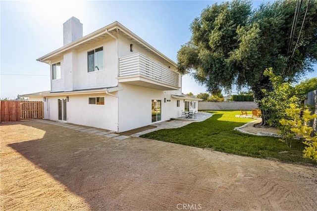 5662 Trail View Pl, Yorba Linda, CA 92886 - rear view of house featuring a chimney, a patio area, stucco siding, and a balcony