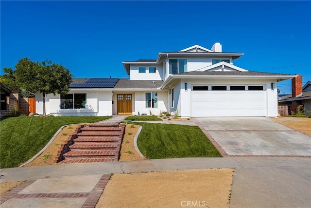 5662 Trail View Pl, Yorba Linda, CA 92886 - view of front of property with stucco siding, a front yard, roof mounted solar panels, and an attached garage