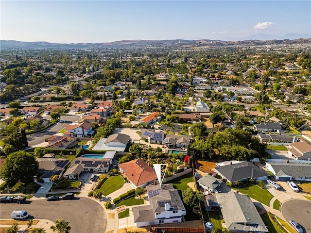 5662 Trail View Pl, Yorba Linda, CA 92886 - aerial overview of property's location with a mountain backdrop and nearby suburban area